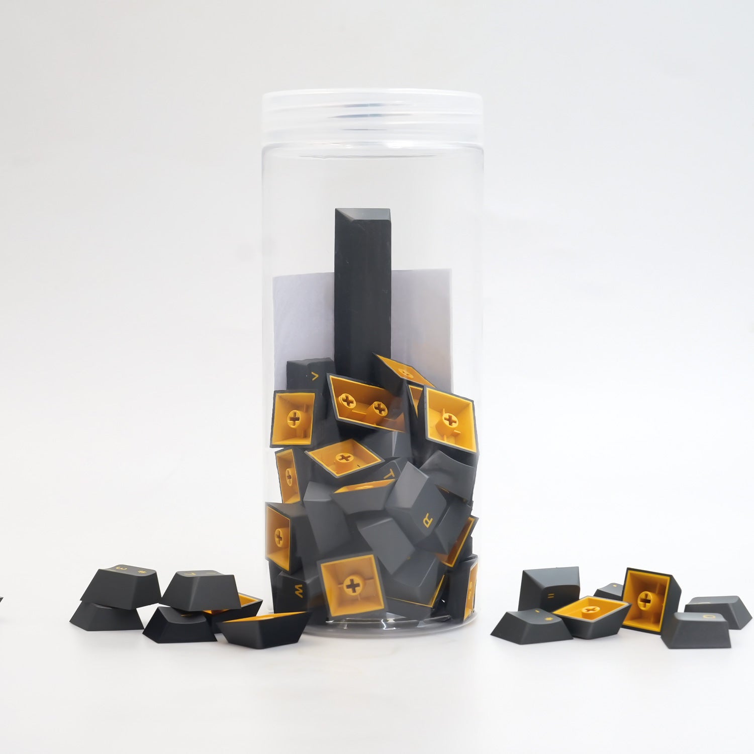 Black & Gold ISO Nordic Tastenkappen Set (76-Tasten) in the jar put on the desk