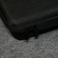 Close-up of a Akko Keyboard Carrying Case on a gray surface