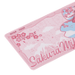 Pink mouse pad with "Sakura Miku" written on it, perfect for fans of the character.