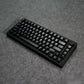 Black MonsGeek M1 V5 HE Magnetic Keyboard Details on a gray textured surface