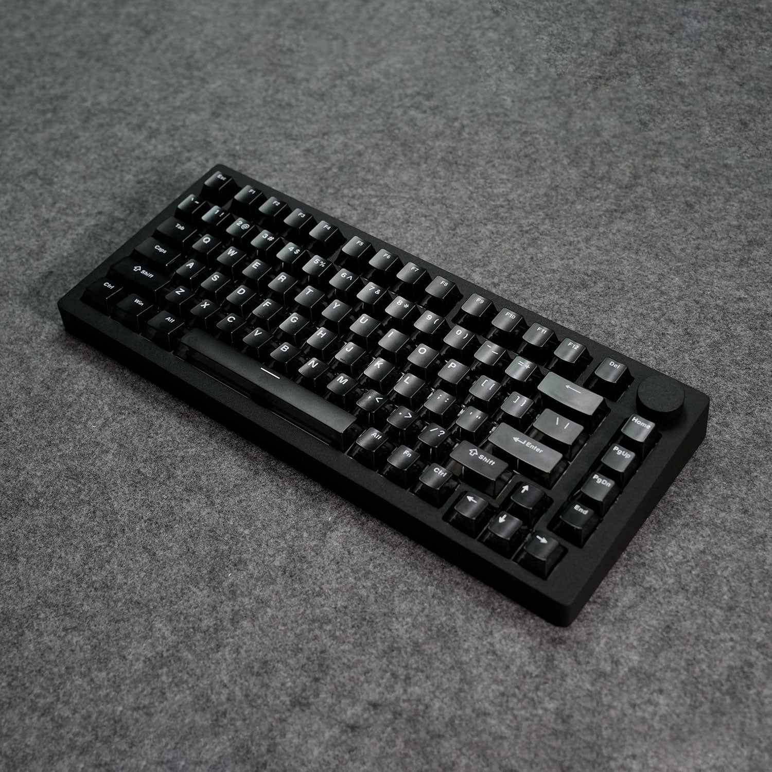 Black MonsGeek M1 V5 HE Magnetic Keyboard Details on a gray textured surface