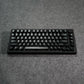 Black MonsGeek M1 V5 HE Magnetic Keyboard on a gray surface