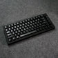Black MonsGeek M1 V5 HE Magnetic Keyboard on a gray textured surface