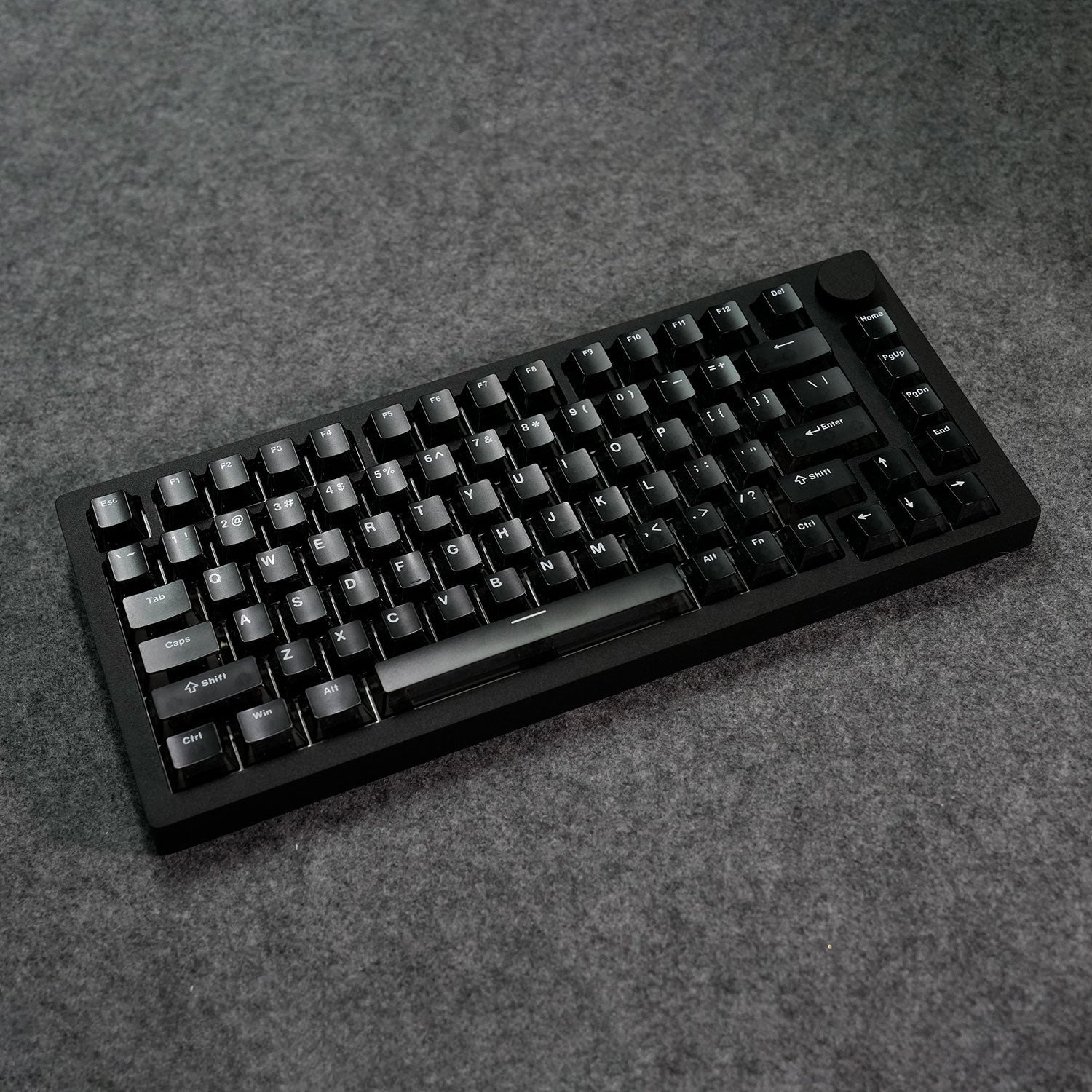 Black MonsGeek M1 V5 HE Magnetic Keyboard on a gray textured surface