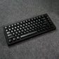 Black MonsGeek M1 V5 HE Magnetic Keyboard on a gray textured surface