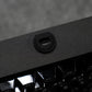 Close-up of a USB port on a black MonsGeek M1 V5 HE Magnetic Keyboard with a blurred background