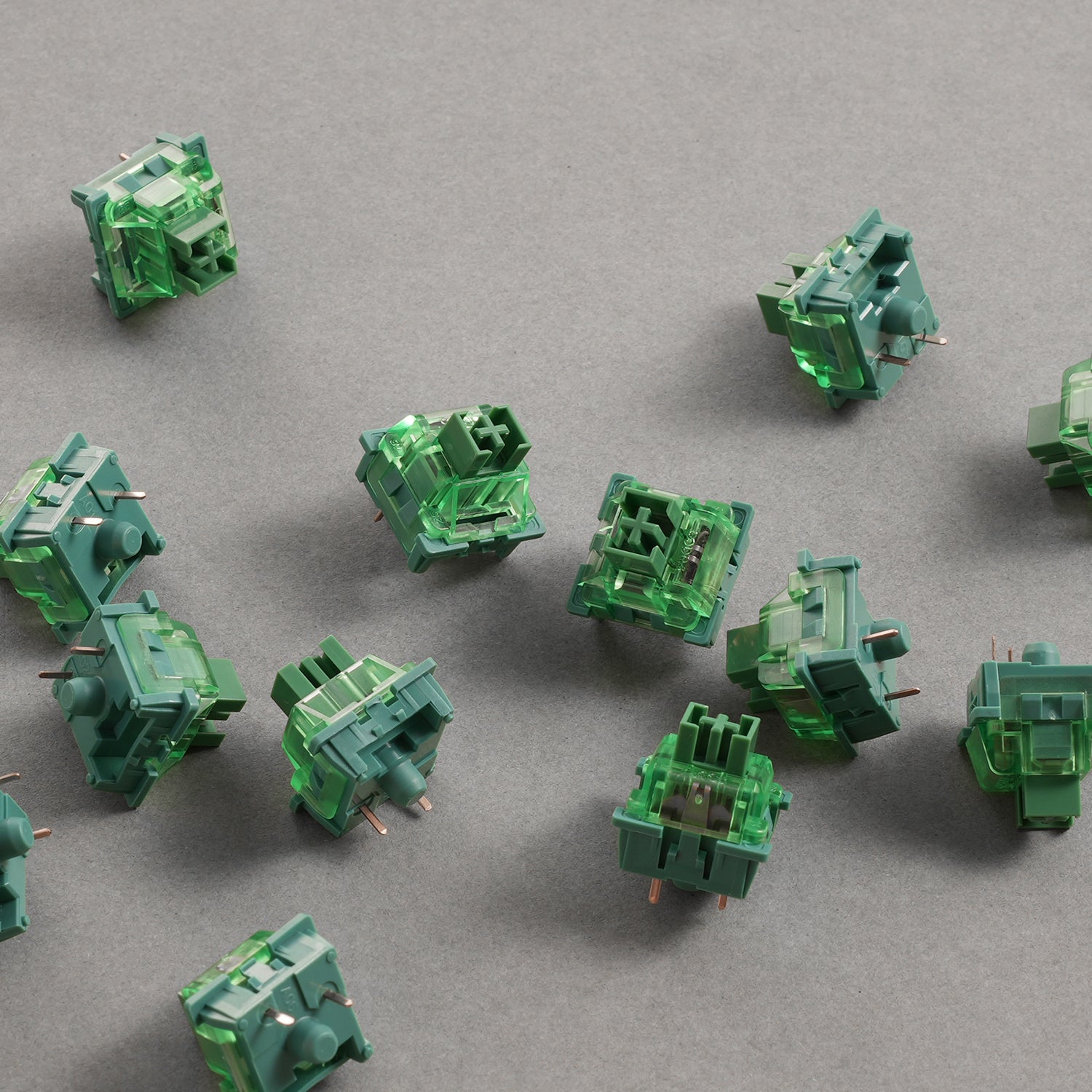 A Collection of V3 Matcha Green Pro Switches on the gray background